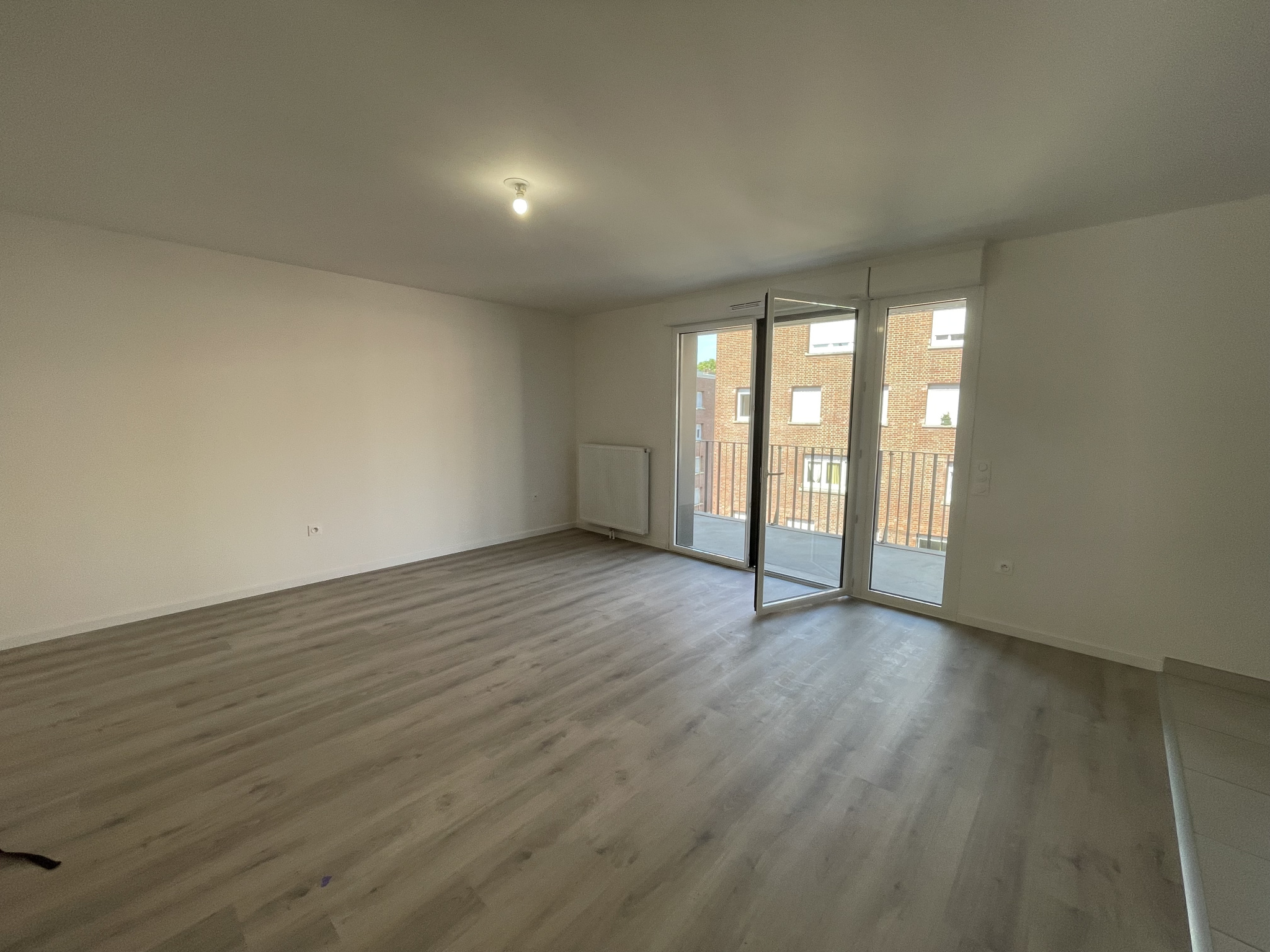 Immo80 – L'immobilier à Amiens et dans la Somme-AMIENS CENTRE VILLE : BEL APPARTEMENT NEUF de 69 m2 avec loggia de 12 m2 et parking en sous-sol
